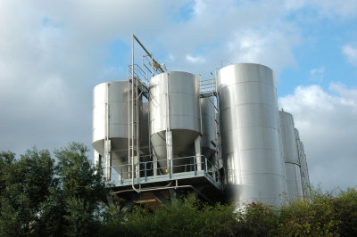 steel tanks containing wine fermenting