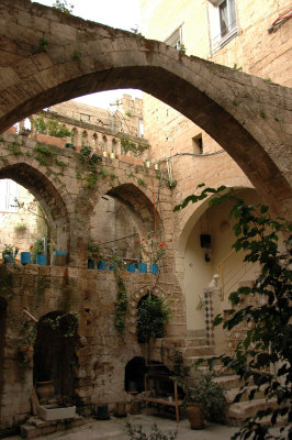 a courtyard decorated with stone arches