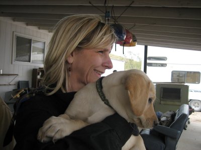 Paula (wearing her Kenya earrings) and Doug's puppy
