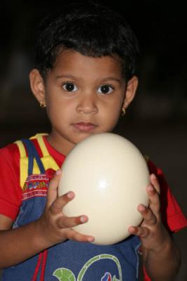 My daughter holding an Ostrich Egg