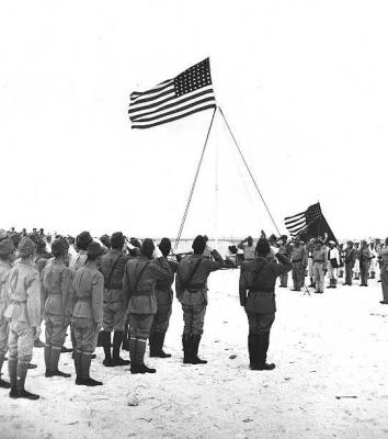 Japs saluting Old Glory (may be when we recaptured Wake Island)