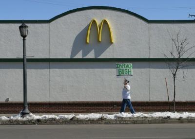 McDonalds: Veteran for Peace carrying an Impeach Bush sign