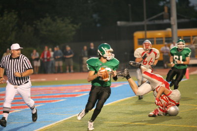 Evan Tripicco looks for a receiver after CV turns the ball over on downs
