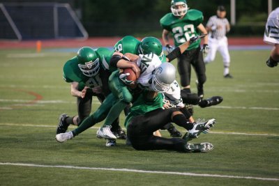 Newfield's running back stopped at the line of scrimmage