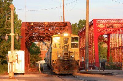 Y207 shoves plastic hoppers towards Berry Plastics in downtown Evansville. In times past, this line was used to shuttle passengers from L&N Howell Yard to their station at Fulton ave and Division Street. Berry is the only customer that remains on the line.