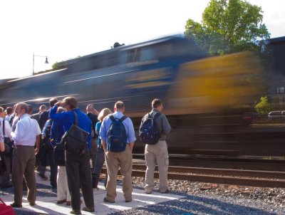 Evening commuters have to wait for an EB coal train to clear after disembarking from their commuter train at Point of Rocks