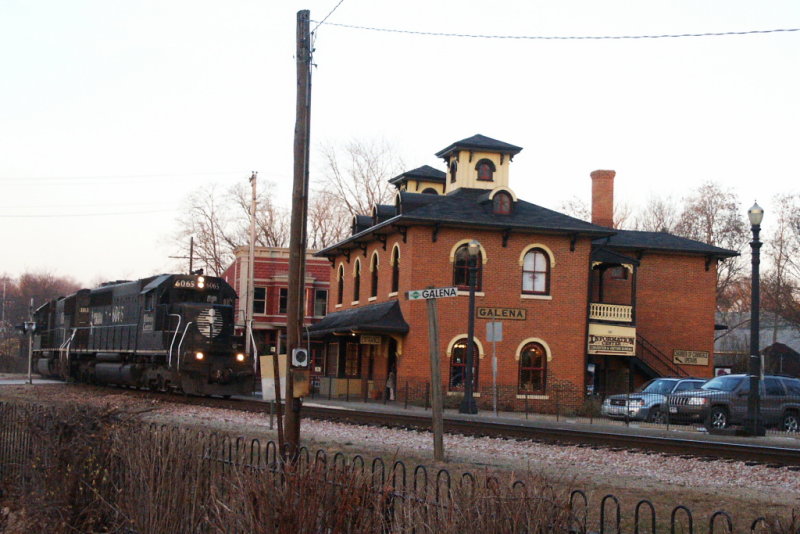 Illinois Central Depot at Galena, Illinois with passing freight train.jpg