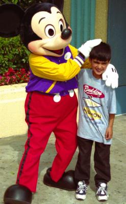Akef with Mickey in Disneyland