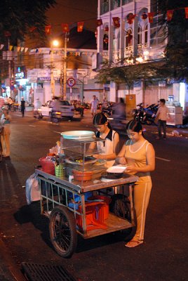 Street vendors making salads, Saigon