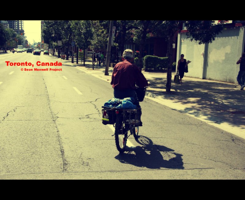 Toronto Canada - Man on Bicycle Riding in Street