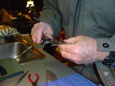 Fred takes the bird's wing measurement