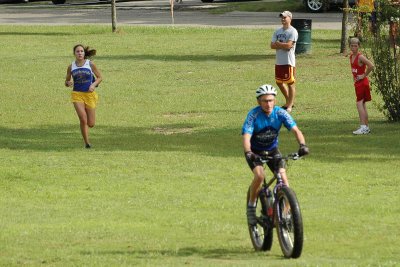 John Kalin escorts the leader to the finish line