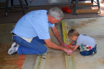 Brooks and Papa mark where the screws go