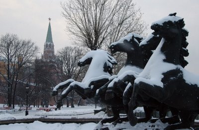 Snow covered horses of Alexandrovsky Garden with a Kremlin tower