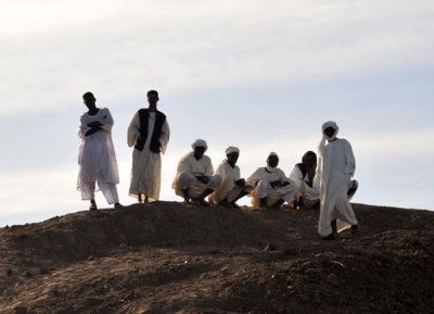 Sudanese men waiting for the Old Dongola Ferry on the West Bank