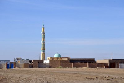 Village with a tall minaret at km 407