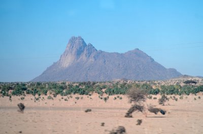 Eastern face of a thousand foot peak rising out of the desert north of the village of Tahamyam