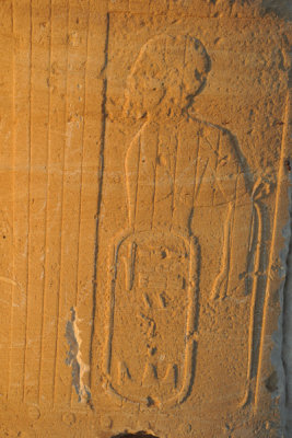 Carving of a man with a cartouche