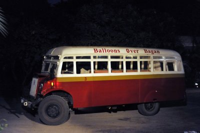 Ancient British bus from the colonial-era picking up passengers for Balloons over Bagan