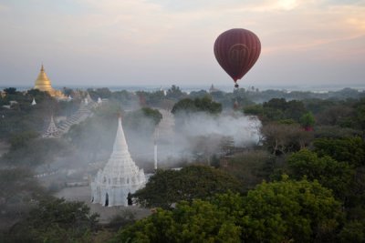 Balloon passing over a smoking fire, Bagan