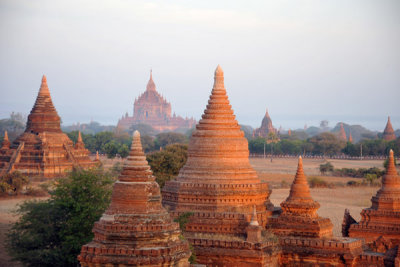 Passing close to a cluster of stupas with Sulamani Temple in the distance