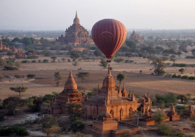 Balloon climbing to pass over the top of a temple