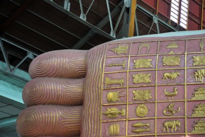 Buddhist sacred symbols on the soles of the feet