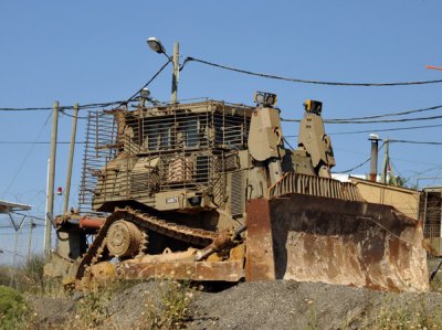 Armored Israeli army bulldozer parked along the Hwy 60 near Hebron