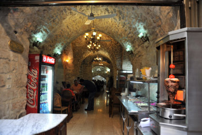 A small restaurant serving shwarma in an ancient space along Bab al-Silsila Street in the Muslim Quarter