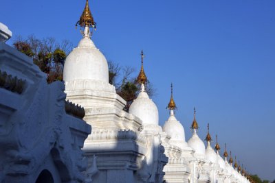 Stupas housing the 729 marble slabs recording the Tripitaka - 15 volumes of Bhuddist scripture