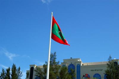 Flag of the Republic of the Maldives flying over Jumhooree Maidan, Republic Square