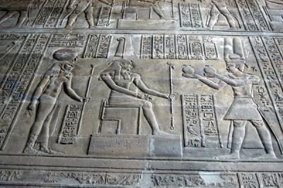 Maat, goddess of justice, seated, receiving offerings