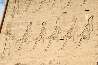 Ptolemy XII facing Horus the Elder, Hathor, Montu (god of war), Harsomtus (Horus the Younger), and Sekhmet