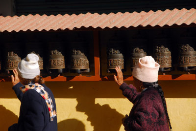 Turning prayer wheels, Tsamchem Gompa, Bodhnath