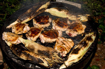 grilled chicken thighs and fresh corn on the cob