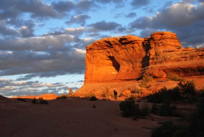 Hiker retreating from the arch