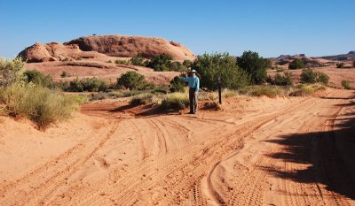 Tourist points the way at a junction