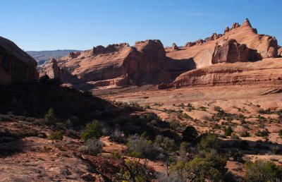 The route down into the amphitheater; note faint boundary post sign at far left