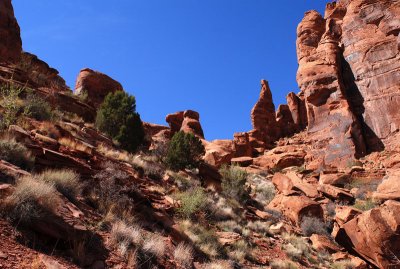 The route up goes to the left of the two short towers just left of center