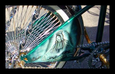 Chicana painted on a lowrider bike