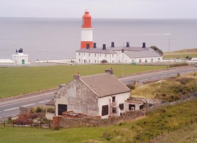 Souter Light and fog horn with the old post office in the foreground.