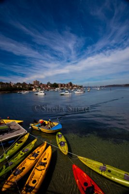 Kayaks at Manly with sky