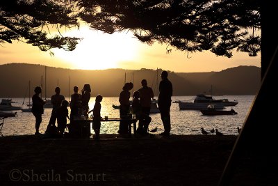 Silhouette of a family at barbie at Pittwater, Sydney