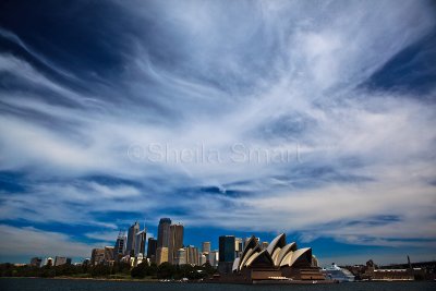 Sydney Opera House and city with dramatic sky