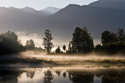 Mist dawn at Lake Matheson with Mt Cook