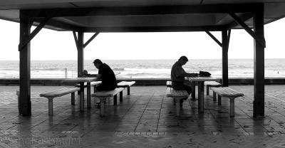 Two readers at Manly Beach