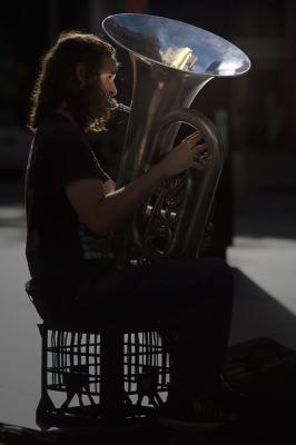 Backlit tuba player