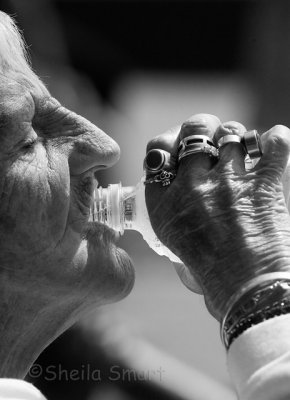 Elderly woman drinking