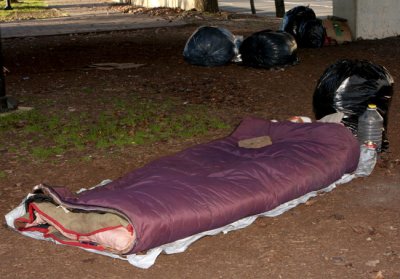 homeless encampment in the shadow of the Federal Reserve bank