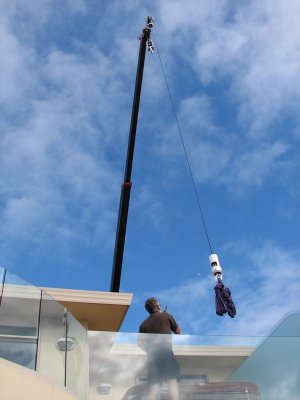 The boom arrives over the other side of house